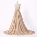 صورة فستان سهرة ذهبي بلمعة ميتاليك وتصميم صدر (Guess)