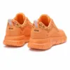 صورة حذاء رياضي برتقالي حيوي (Elis)